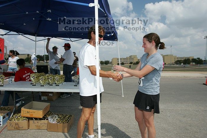 Beth Marek won first place in her age division at the Army Dillo half-marathon and 32K race.

Filename: SRM_20080921_1202061.jpg
Aperture: f/8.0
Shutter Speed: 1/250
Body: Canon EOS-1D Mark II
Lens: Canon EF 16-35mm f/2.8 L