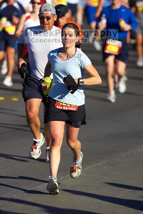 Beth Marek, bib #4236, completed the course in 3:38:21, a Boston Marathon qualifying time.  The first annual San Antonio Rock and Roll Marathon, Sunday, November 16, 2008.

Filename: SRM_20081116_08520014.jpg
Aperture: f/4.0
Shutter Speed: 1/3200
Body: Canon EOS-1D Mark II
Lens: Canon EF 300mm f/2.8 L IS