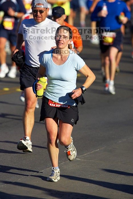 Beth Marek, bib #4236, completed the course in 3:38:21, a Boston Marathon qualifying time.  The first annual San Antonio Rock and Roll Marathon, Sunday, November 16, 2008.

Filename: SRM_20081116_08520215.jpg
Aperture: f/4.0
Shutter Speed: 1/3200
Body: Canon EOS-1D Mark II
Lens: Canon EF 300mm f/2.8 L IS