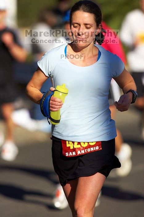 Beth Marek, bib #4236, completed the course in 3:38:21, a Boston Marathon qualifying time.  The first annual San Antonio Rock and Roll Marathon, Sunday, November 16, 2008.

Filename: SRM_20081116_09064244.jpg
Aperture: f/4.0
Shutter Speed: 1/3200
Body: Canon EOS-1D Mark II
Lens: Canon EF 300mm f/2.8 L IS