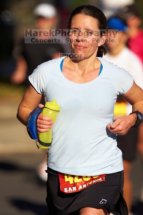 Beth Marek, bib #4236, completed the course in 3:38:21, a Boston Marathon qualifying time.  The first annual San Antonio Rock and Roll Marathon, Sunday, November 16, 2008.

Filename: SRM_20081116_09064647.jpg
Aperture: f/4.0
Shutter Speed: 1/4000
Body: Canon EOS-1D Mark II
Lens: Canon EF 300mm f/2.8 L IS