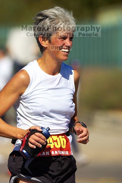 Karen Pearce.  The first annual San Antonio Rock and Roll Marathon, Sunday, November 16, 2008.

Filename: SRM_20081116_12014271.jpg
Aperture: f/4.0
Shutter Speed: 1/3200
Body: Canon EOS-1D Mark II
Lens: Canon EF 300mm f/2.8 L IS