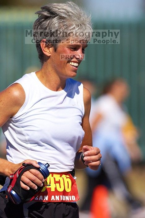 Karen Pearce.  The first annual San Antonio Rock and Roll Marathon, Sunday, November 16, 2008.

Filename: SRM_20081116_12014675.jpg
Aperture: f/4.0
Shutter Speed: 1/3200
Body: Canon EOS-1D Mark II
Lens: Canon EF 300mm f/2.8 L IS