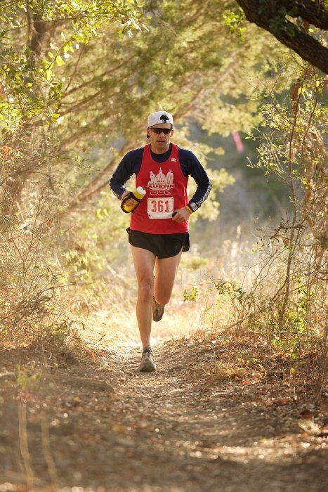 Paul Terranova placed first in his age group, fourth overall in the 25K at the Bandera 25K, 50K, and 100K trail race in Bandera, TX on Saturday, January 10, 2009.

Filename: SRM_20090110_09020636.jpg
Aperture: f/2.8
Shutter Speed: 1/400
Body: Canon EOS-1D Mark II
Lens: Canon EF 300mm f/2.8 L IS