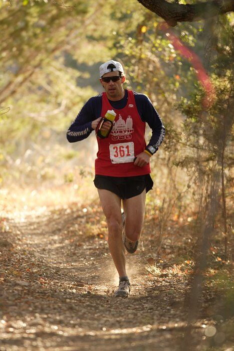 Paul Terranova placed first in his age group, fourth overall in the 25K at the Bandera 25K, 50K, and 100K trail race in Bandera, TX on Saturday, January 10, 2009.

Filename: SRM_20090110_09022042.jpg
Aperture: f/2.8
Shutter Speed: 1/400
Body: Canon EOS-1D Mark II
Lens: Canon EF 300mm f/2.8 L IS