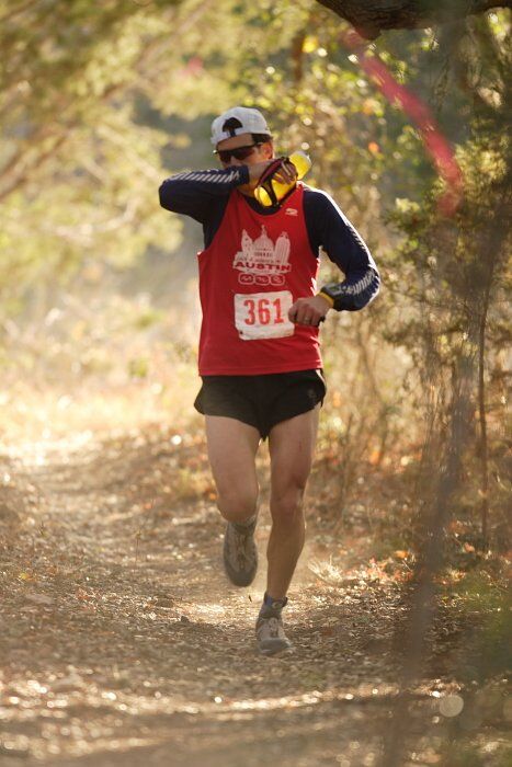 Paul Terranova placed first in his age group, fourth overall in the 25K at the Bandera 25K, 50K, and 100K trail race in Bandera, TX on Saturday, January 10, 2009.

Filename: SRM_20090110_09022243.jpg
Aperture: f/2.8
Shutter Speed: 1/400
Body: Canon EOS-1D Mark II
Lens: Canon EF 300mm f/2.8 L IS