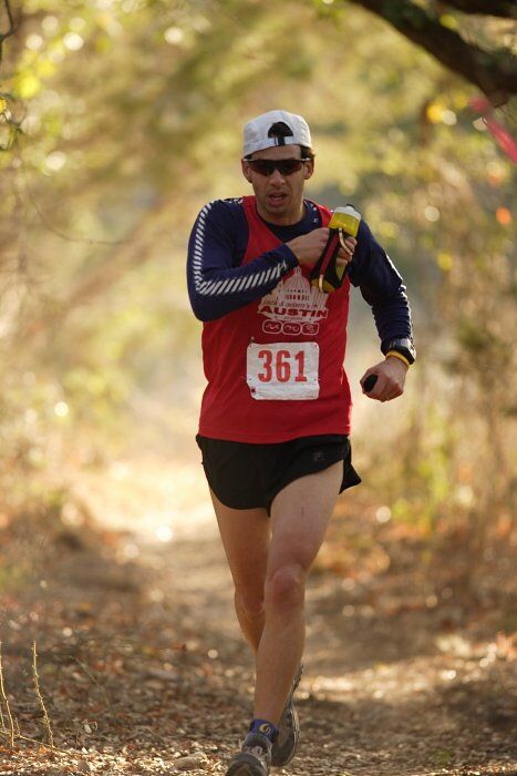 Paul Terranova placed first in his age group, fourth overall in the 25K at the Bandera 25K, 50K, and 100K trail race in Bandera, TX on Saturday, January 10, 2009.

Filename: SRM_20090110_09023047.jpg
Aperture: f/2.8
Shutter Speed: 1/400
Body: Canon EOS-1D Mark II
Lens: Canon EF 300mm f/2.8 L IS