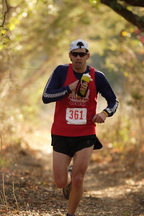 Paul Terranova placed first in his age group, fourth overall in the 25K at the Bandera 25K, 50K, and 100K trail race in Bandera, TX on Saturday, January 10, 2009.

Filename: SRM_20090110_09023448.jpg
Aperture: f/2.8
Shutter Speed: 1/400
Body: Canon EOS-1D Mark II
Lens: Canon EF 300mm f/2.8 L IS