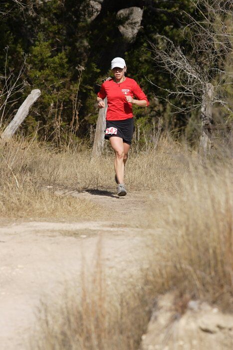 Meredith Terranova placed second overall in the 50K at the Bandera 25K, 50K, and 100K trail race in Bandera, TX on Saturday, January 10, 2009.

Filename: SRM_20090110_12421021.jpg
Aperture: f/5.6
Shutter Speed: 1/640
Body: Canon EOS-1D Mark II
Lens: Canon EF 300mm f/2.8 L IS