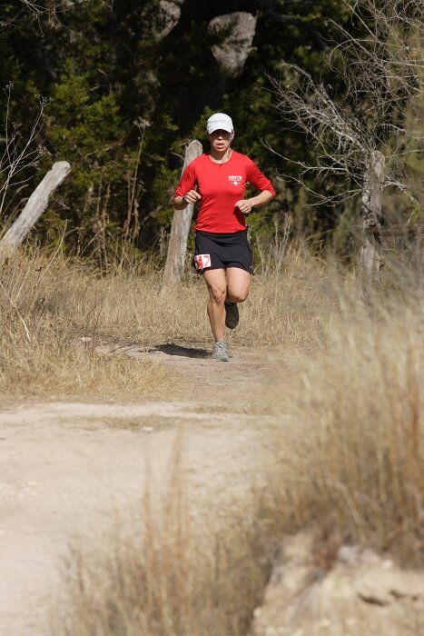 Meredith Terranova placed second overall in the 50K at the Bandera 25K, 50K, and 100K trail race in Bandera, TX on Saturday, January 10, 2009.

Filename: SRM_20090110_12421422.jpg
Aperture: f/5.6
Shutter Speed: 1/640
Body: Canon EOS-1D Mark II
Lens: Canon EF 300mm f/2.8 L IS