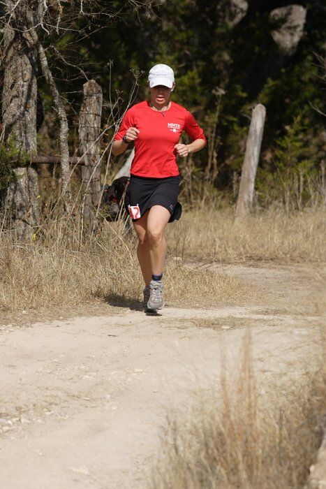 Meredith Terranova placed second overall in the 50K at the Bandera 25K, 50K, and 100K trail race in Bandera, TX on Saturday, January 10, 2009.

Filename: SRM_20090110_12421623.jpg
Aperture: f/5.6
Shutter Speed: 1/640
Body: Canon EOS-1D Mark II
Lens: Canon EF 300mm f/2.8 L IS