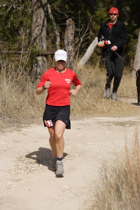 Meredith Terranova placed second overall in the 50K at the Bandera 25K, 50K, and 100K trail race in Bandera, TX on Saturday, January 10, 2009.

Filename: SRM_20090110_12422025.jpg
Aperture: f/5.6
Shutter Speed: 1/640
Body: Canon EOS-1D Mark II
Lens: Canon EF 300mm f/2.8 L IS