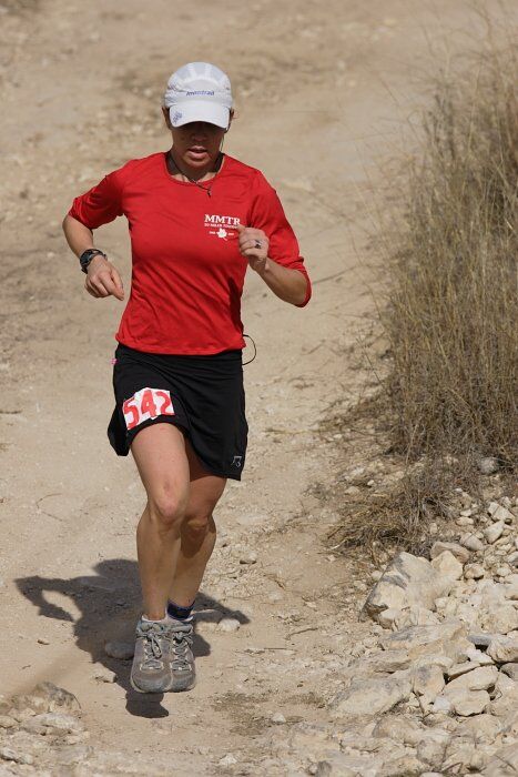 Meredith Terranova placed second overall in the 50K at the Bandera 25K, 50K, and 100K trail race in Bandera, TX on Saturday, January 10, 2009.

Filename: SRM_20090110_12422628.jpg
Aperture: f/5.6
Shutter Speed: 1/1250
Body: Canon EOS-1D Mark II
Lens: Canon EF 300mm f/2.8 L IS