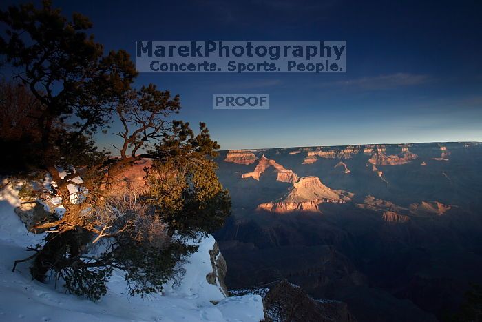 First sunrise of the new year at the south rim of the Grand Canyon, Thursday January 1, 2009.  The temperature was as low as 15 F the night before with a foot and a half of snow on the ground.  Luckily sunrise wasn't until 7:40.

Filename: SRM_20090101_07572224.JPG
Aperture: f/14.0
Shutter Speed: 1/13
Body: Canon EOS-1D Mark II
Lens: Canon EF 16-35mm f/2.8 L