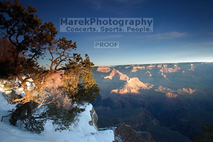 First sunrise of the new year at the south rim of the Grand Canyon, Thursday January 1, 2009.  The temperature was as low as 15 F the night before with a foot and a half of snow on the ground.  Luckily sunrise wasn't until 7:40.

Filename: SRM_20090101_07573925.JPG
Aperture: f/14.0
Shutter Speed: 6/10
Body: Canon EOS-1D Mark II
Lens: Canon EF 16-35mm f/2.8 L