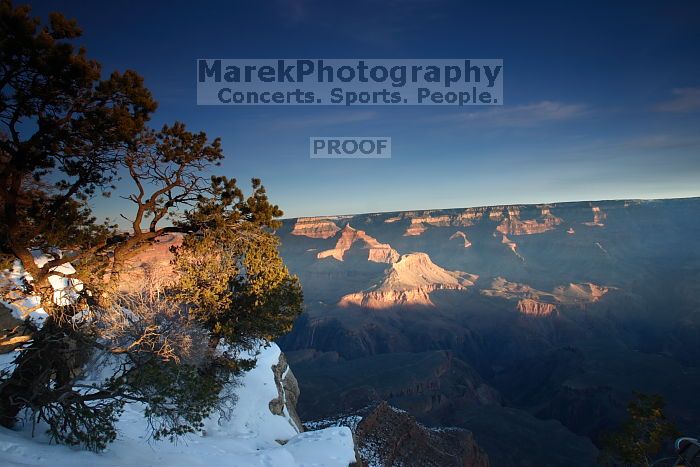 First sunrise of the new year at the south rim of the Grand Canyon, Thursday January 1, 2009.  The temperature was as low as 15 F the night before with a foot and a half of snow on the ground.  Luckily sunrise wasn't until 7:40.

Filename: SRM_20090101_07581026.JPG
Aperture: f/14.0
Shutter Speed: 3/10
Body: Canon EOS-1D Mark II
Lens: Canon EF 16-35mm f/2.8 L