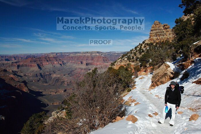 Beth Marek hiking down the South Kaibab trail, backpacking the Grand Canyon with Beth, Thursday, January 1, 2009.

Filename: SRM_20090101_12064968.jpg
Aperture: f/16.0
Shutter Speed: 1/250
Body: Canon EOS-1D Mark II
Lens: Canon EF 16-35mm f/2.8 L