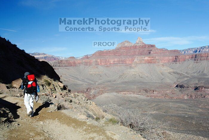 Beth Marek hiking down the South Kaibab trail, backpacking the Grand Canyon with Beth, Thursday, January 1, 2009.

Filename: SRM_20090101_14455153.jpg
Aperture: f/11.0
Shutter Speed: 1/125
Body: Canon EOS-1D Mark II
Lens: Canon EF 16-35mm f/2.8 L