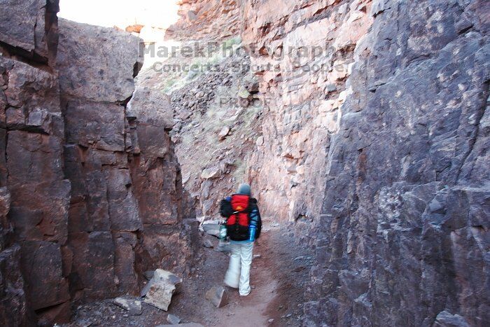 Beth Marek hiking down the South Kaibab trail, backpacking the Grand Canyon with Beth, Thursday, January 1, 2009.

Filename: SRM_20090101_15274679.jpg
Aperture: f/11.0
Shutter Speed: 1/5
Body: Canon EOS-1D Mark II
Lens: Canon EF 16-35mm f/2.8 L