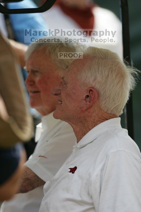 One of these guys is Darrell Royal (I think?).  The University of Texas football team defeated the Arkansas Razorbacks with a score of 52-10 in Austin, TX on Saturday, September 27, 2008.

Filename: SRM_20080927_14160202.jpg
Aperture: f/4.0
Shutter Speed: 1/1600
Body: Canon EOS-1D Mark II
Lens: Canon EF 300mm f/2.8 L IS