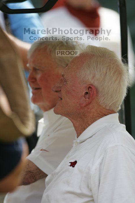 One of these guys is Darrell Royal (I think?).  The University of Texas football team defeated the Arkansas Razorbacks with a score of 52-10 in Austin, TX on Saturday, September 27, 2008.

Filename: SRM_20080927_14160203.jpg
Aperture: f/4.0
Shutter Speed: 1/1250
Body: Canon EOS-1D Mark II
Lens: Canon EF 300mm f/2.8 L IS