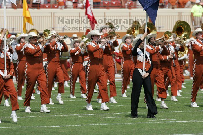 The UT marching band takes the field before the Arkansas football game.  The University of Texas football team defeated the Arkansas Razorbacks with a score of 52-10 in Austin, TX on Saturday, September 27, 2008.

Filename: SRM_20080927_14193614.jpg
Aperture: f/5.6
Shutter Speed: 1/1600
Body: Canon EOS-1D Mark II
Lens: Canon EF 300mm f/2.8 L IS