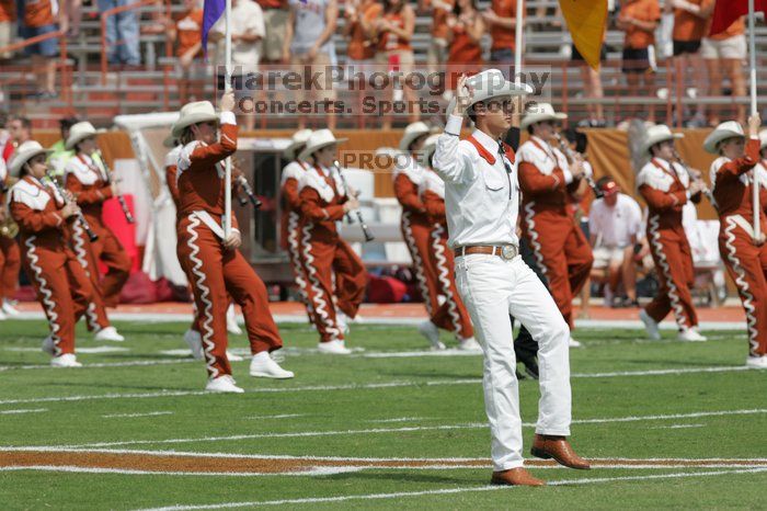 The UT marching band takes the field before the Arkansas football game.  The University of Texas football team defeated the Arkansas Razorbacks with a score of 52-10 in Austin, TX on Saturday, September 27, 2008.

Filename: SRM_20080927_14194015.jpg
Aperture: f/5.6
Shutter Speed: 1/1600
Body: Canon EOS-1D Mark II
Lens: Canon EF 300mm f/2.8 L IS