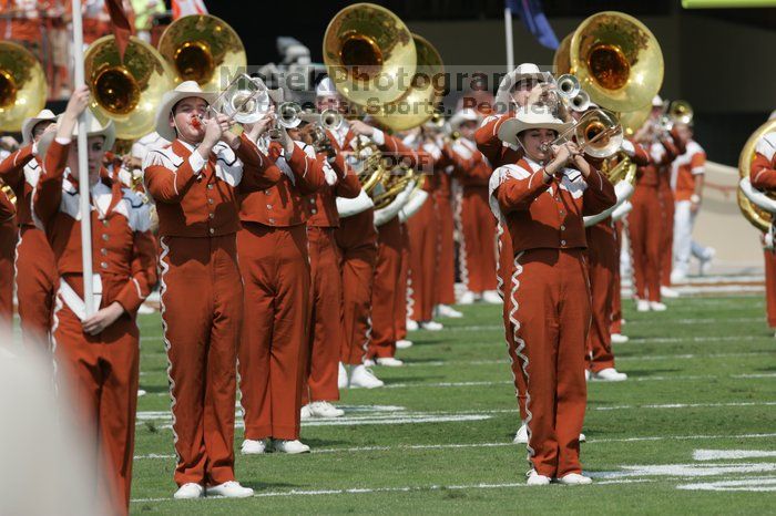 The UT marching band takes the field before the Arkansas football game.  The University of Texas football team defeated the Arkansas Razorbacks with a score of 52-10 in Austin, TX on Saturday, September 27, 2008.

Filename: SRM_20080927_14200624.jpg
Aperture: f/5.6
Shutter Speed: 1/1600
Body: Canon EOS-1D Mark II
Lens: Canon EF 300mm f/2.8 L IS