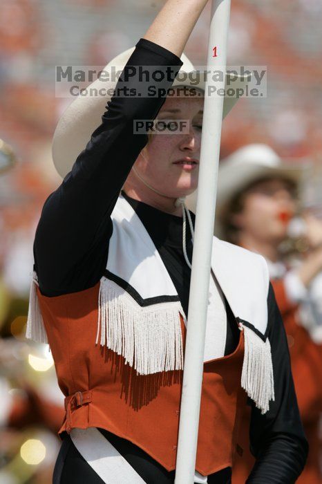 The UT marching band takes the field before the Arkansas football game.  The University of Texas football team defeated the Arkansas Razorbacks with a score of 52-10 in Austin, TX on Saturday, September 27, 2008.

Filename: SRM_20080927_14202225.jpg
Aperture: f/5.6
Shutter Speed: 1/1600
Body: Canon EOS-1D Mark II
Lens: Canon EF 300mm f/2.8 L IS