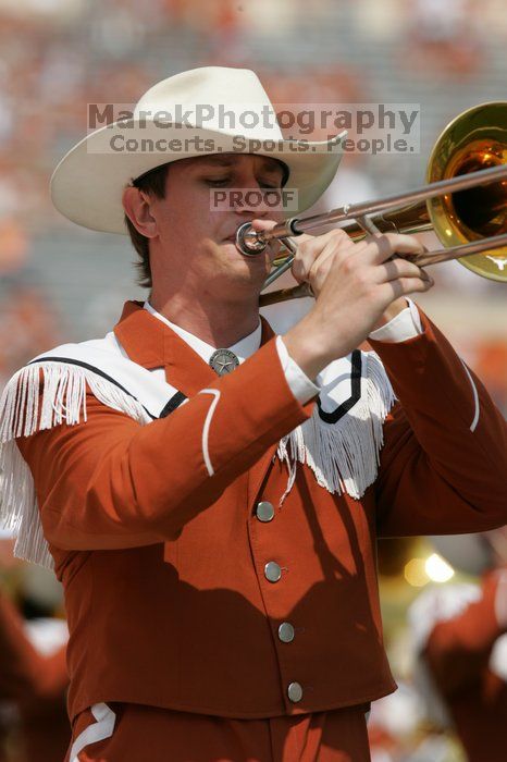 The UT marching band takes the field before the Arkansas football game.  The University of Texas football team defeated the Arkansas Razorbacks with a score of 52-10 in Austin, TX on Saturday, September 27, 2008.

Filename: SRM_20080927_14202429.jpg
Aperture: f/5.6
Shutter Speed: 1/1600
Body: Canon EOS-1D Mark II
Lens: Canon EF 300mm f/2.8 L IS