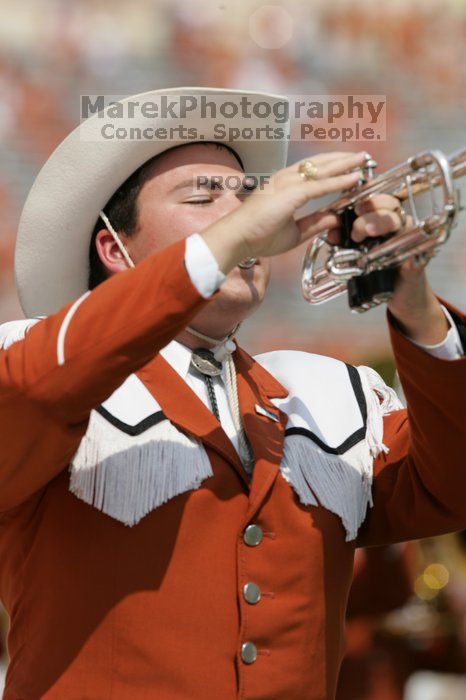 The UT marching band takes the field before the Arkansas football game.  The University of Texas football team defeated the Arkansas Razorbacks with a score of 52-10 in Austin, TX on Saturday, September 27, 2008.

Filename: SRM_20080927_14202831.jpg
Aperture: f/5.6
Shutter Speed: 1/1600
Body: Canon EOS-1D Mark II
Lens: Canon EF 300mm f/2.8 L IS