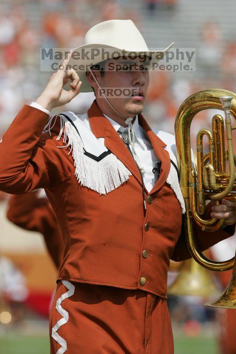 The UT marching band takes the field before the Arkansas football game.  The University of Texas football team defeated the Arkansas Razorbacks with a score of 52-10 in Austin, TX on Saturday, September 27, 2008.

Filename: SRM_20080927_14203636.jpg
Aperture: f/5.6
Shutter Speed: 1/1600
Body: Canon EOS-1D Mark II
Lens: Canon EF 300mm f/2.8 L IS