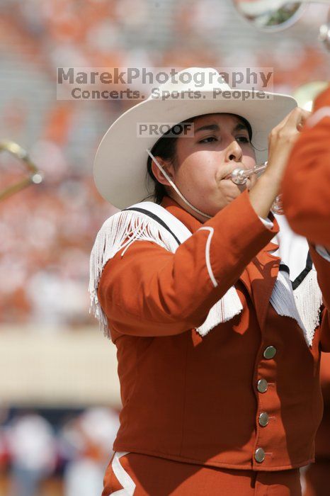 The UT marching band takes the field before the Arkansas football game.  The University of Texas football team defeated the Arkansas Razorbacks with a score of 52-10 in Austin, TX on Saturday, September 27, 2008.

Filename: SRM_20080927_14204638.jpg
Aperture: f/5.6
Shutter Speed: 1/1250
Body: Canon EOS-1D Mark II
Lens: Canon EF 300mm f/2.8 L IS