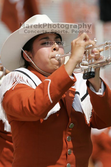 The UT marching band takes the field before the Arkansas football game.  The University of Texas football team defeated the Arkansas Razorbacks with a score of 52-10 in Austin, TX on Saturday, September 27, 2008.

Filename: SRM_20080927_14204840.jpg
Aperture: f/5.6
Shutter Speed: 1/1250
Body: Canon EOS-1D Mark II
Lens: Canon EF 300mm f/2.8 L IS