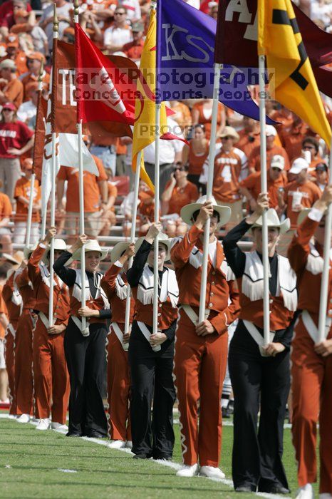 The UT marching band takes the field before the Arkansas football game.  The University of Texas football team defeated the Arkansas Razorbacks with a score of 52-10 in Austin, TX on Saturday, September 27, 2008.

Filename: SRM_20080927_14214044.jpg
Aperture: f/5.6
Shutter Speed: 1/1250
Body: Canon EOS-1D Mark II
Lens: Canon EF 300mm f/2.8 L IS