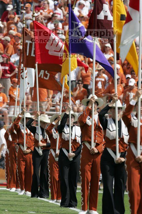 The UT marching band takes the field before the Arkansas football game.  The University of Texas football team defeated the Arkansas Razorbacks with a score of 52-10 in Austin, TX on Saturday, September 27, 2008.

Filename: SRM_20080927_14214245.jpg
Aperture: f/5.6
Shutter Speed: 1/1250
Body: Canon EOS-1D Mark II
Lens: Canon EF 300mm f/2.8 L IS