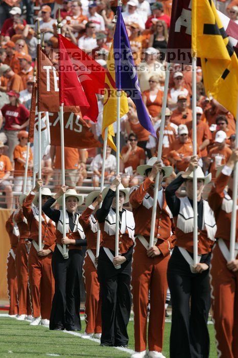 The UT marching band takes the field before the Arkansas football game.  The University of Texas football team defeated the Arkansas Razorbacks with a score of 52-10 in Austin, TX on Saturday, September 27, 2008.

Filename: SRM_20080927_14214447.jpg
Aperture: f/5.6
Shutter Speed: 1/1250
Body: Canon EOS-1D Mark II
Lens: Canon EF 300mm f/2.8 L IS