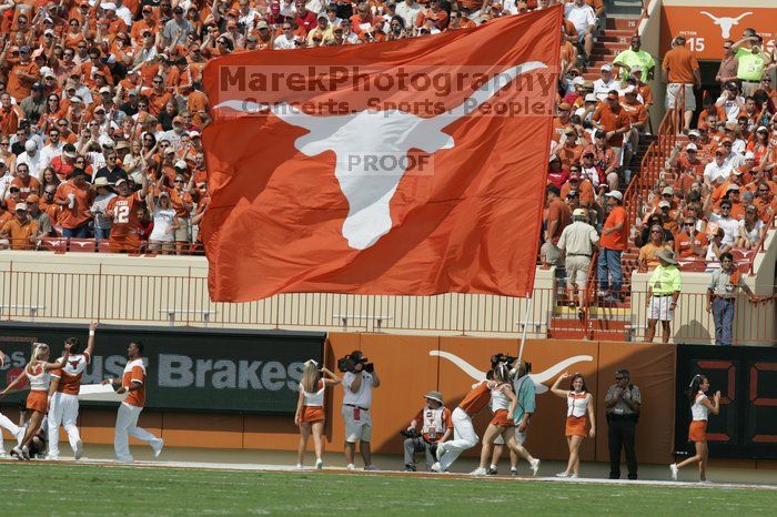 Texas Cheerleaders.  The University of Texas football team defeated the Arkansas Razorbacks with a score of 52-10 in Austin, TX on Saturday, September 27, 2008.

Filename: SRM_20080927_14425400.jpg
Aperture: f/5.6
Shutter Speed: 1/2500
Body: Canon EOS-1D Mark II
Lens: Canon EF 300mm f/2.8 L IS