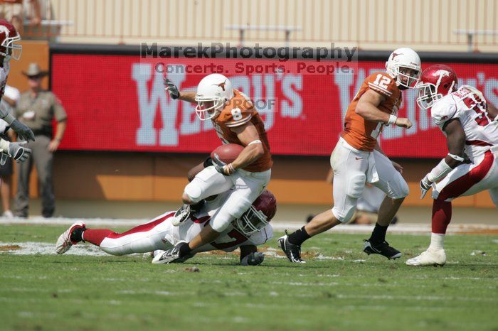 The University of Texas football team defeated the Arkansas Razorbacks with a score of 52-10 in Austin, TX on Saturday, September 27, 2008.

Filename: SRM_20080927_15090890.jpg
Aperture: f/5.6
Shutter Speed: 1/2000
Body: Canon EOS-1D Mark II
Lens: Canon EF 300mm f/2.8 L IS