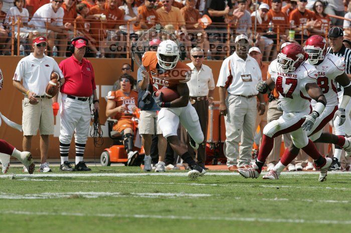 The University of Texas football team defeated the Arkansas Razorbacks with a score of 52-10 in Austin, TX on Saturday, September 27, 2008.

Filename: SRM_20080927_15121416.jpg
Aperture: f/5.6
Shutter Speed: 1/1250
Body: Canon EOS-1D Mark II
Lens: Canon EF 300mm f/2.8 L IS