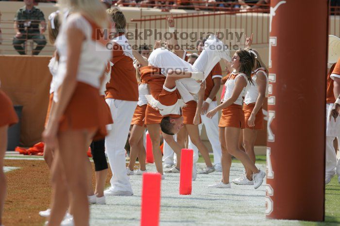 Texas Cheerleaders.  The University of Texas football team defeated the Arkansas Razorbacks with a score of 52-10 in Austin, TX on Saturday, September 27, 2008.

Filename: SRM_20080927_15182449.jpg
Aperture: f/6.3
Shutter Speed: 1/1000
Body: Canon EOS-1D Mark II
Lens: Canon EF 300mm f/2.8 L IS