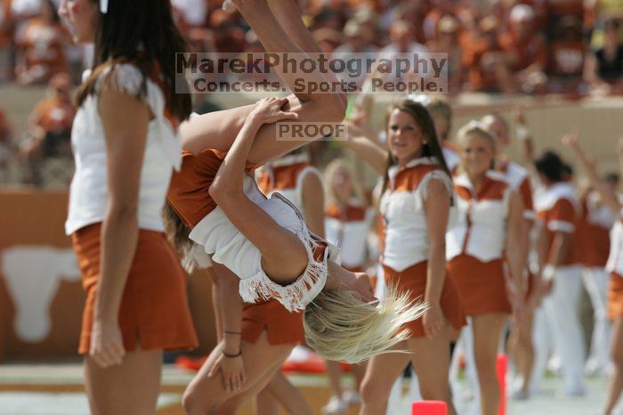 Texas Cheerleaders.  The University of Texas football team defeated the Arkansas Razorbacks with a score of 52-10 in Austin, TX on Saturday, September 27, 2008.

Filename: SRM_20080927_15183061.jpg
Aperture: f/6.3
Shutter Speed: 1/1000
Body: Canon EOS-1D Mark II
Lens: Canon EF 300mm f/2.8 L IS