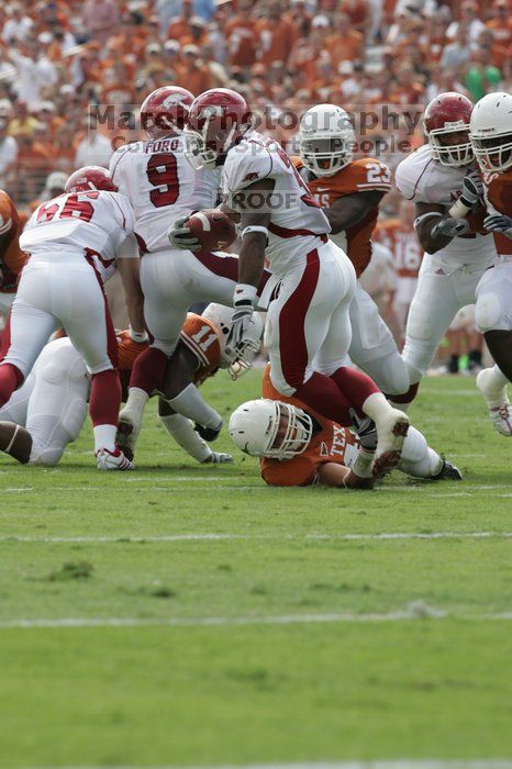 The University of Texas football team defeated the Arkansas Razorbacks with a score of 52-10 in Austin, TX on Saturday, September 27, 2008.

Filename: SRM_20080927_15191675.jpg
Aperture: f/6.3
Shutter Speed: 1/500
Body: Canon EOS-1D Mark II
Lens: Canon EF 300mm f/2.8 L IS