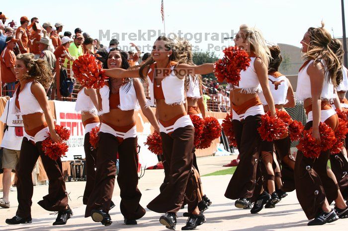 Texas Pom.  The University of Texas football team defeated the Arkansas Razorbacks with a score of 52-10 in Austin, TX on Saturday, September 27, 2008.

Filename: SRM_20080927_15320860.jpg
Aperture: f/5.6
Shutter Speed: 1/1600
Body: Canon EOS 20D
Lens: Canon EF 80-200mm f/2.8 L