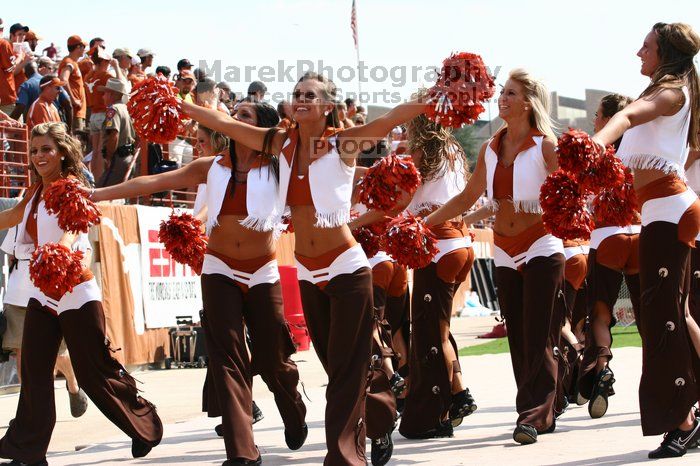 Texas Pom.  The University of Texas football team defeated the Arkansas Razorbacks with a score of 52-10 in Austin, TX on Saturday, September 27, 2008.

Filename: SRM_20080927_15320861.jpg
Aperture: f/5.6
Shutter Speed: 1/1600
Body: Canon EOS 20D
Lens: Canon EF 80-200mm f/2.8 L