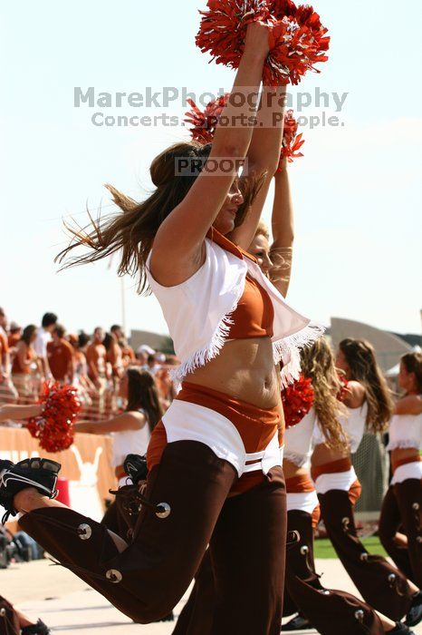 Texas Pom.  The University of Texas football team defeated the Arkansas Razorbacks with a score of 52-10 in Austin, TX on Saturday, September 27, 2008.

Filename: SRM_20080927_15321262.jpg
Aperture: f/5.6
Shutter Speed: 1/1600
Body: Canon EOS 20D
Lens: Canon EF 80-200mm f/2.8 L