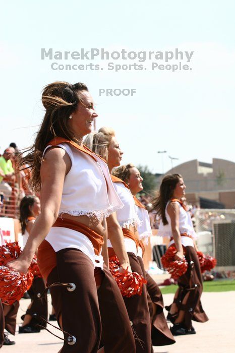 Texas Pom.  The University of Texas football team defeated the Arkansas Razorbacks with a score of 52-10 in Austin, TX on Saturday, September 27, 2008.

Filename: SRM_20080927_15322265.jpg
Aperture: f/5.6
Shutter Speed: 1/1600
Body: Canon EOS 20D
Lens: Canon EF 80-200mm f/2.8 L