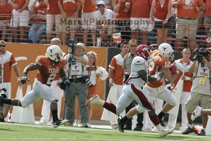 The University of Texas football team defeated the Arkansas Razorbacks with a score of 52-10 in Austin, TX on Saturday, September 27, 2008.

Filename: SRM_20080927_15355843.jpg
Aperture: f/5.6
Shutter Speed: 1/1250
Body: Canon EOS-1D Mark II
Lens: Canon EF 300mm f/2.8 L IS