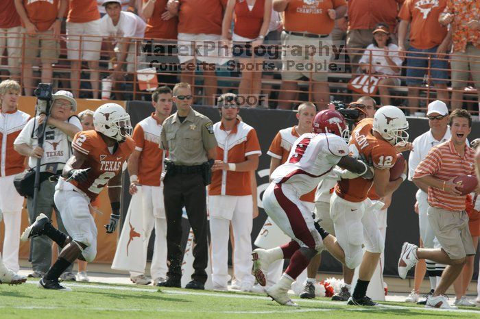 The University of Texas football team defeated the Arkansas Razorbacks with a score of 52-10 in Austin, TX on Saturday, September 27, 2008.

Filename: SRM_20080927_15360044.jpg
Aperture: f/5.6
Shutter Speed: 1/1250
Body: Canon EOS-1D Mark II
Lens: Canon EF 300mm f/2.8 L IS