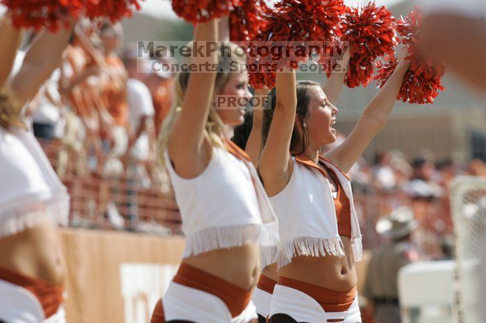 Texas Pom.  The University of Texas football team defeated the Arkansas Razorbacks with a score of 52-10 in Austin, TX on Saturday, September 27, 2008.

Filename: SRM_20080927_15374656.jpg
Aperture: f/5.6
Shutter Speed: 1/1250
Body: Canon EOS-1D Mark II
Lens: Canon EF 300mm f/2.8 L IS